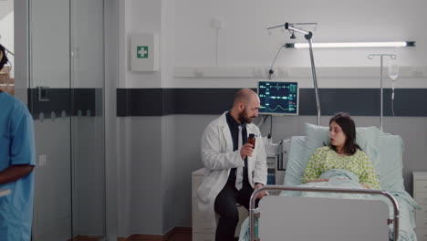 physician medic consulting sick patient during medical appointment