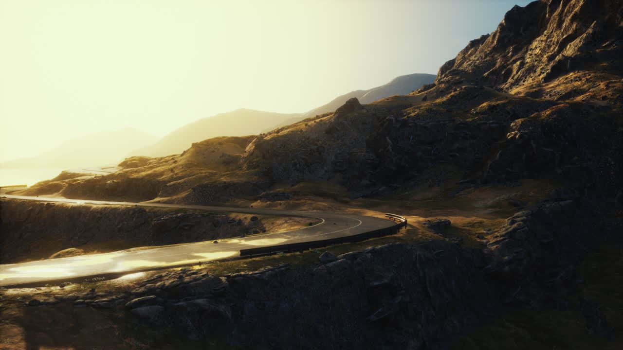 camino de montaña sinuoso al amanecer