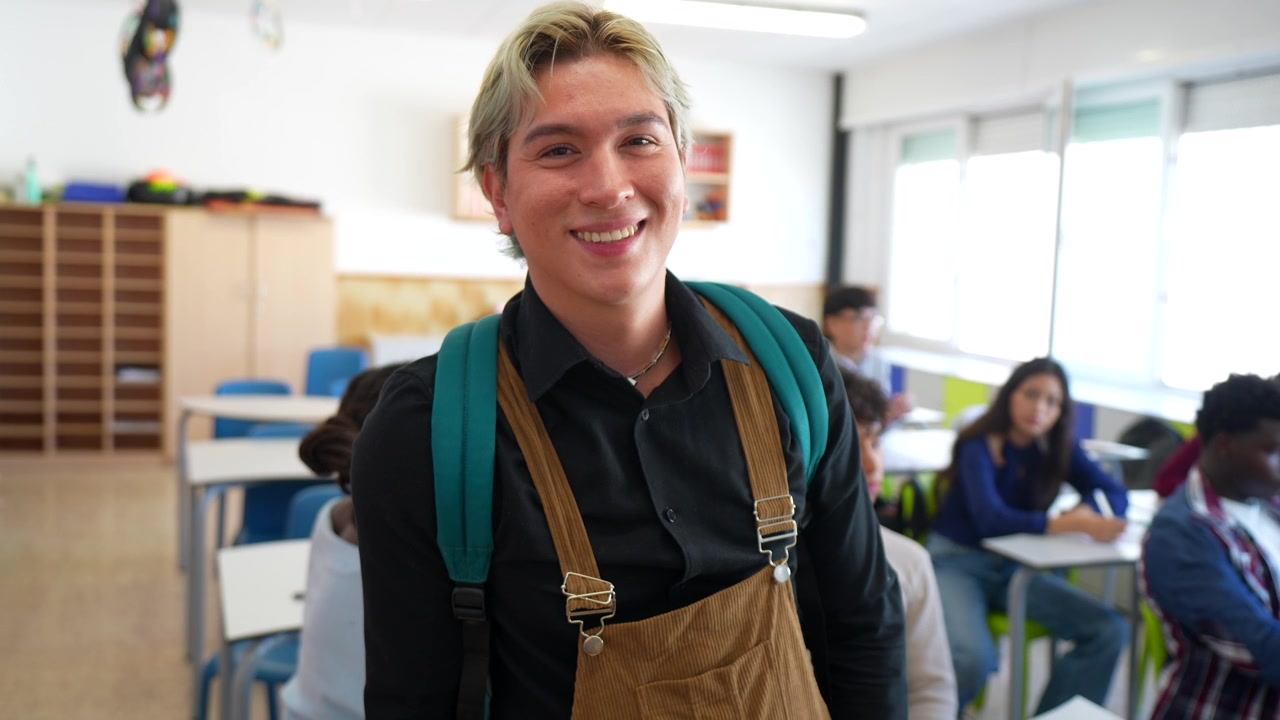 Young Male Student Smiling in a Classroom
