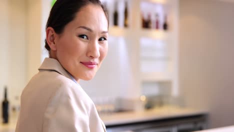 Asian-businesswoman-smiling-at-camera