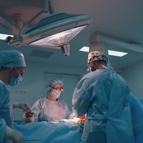 abdominoplasty of the abdomen. abdominal liposuction. partial removal of fat and mucous tissues of the abdomen. the doctor cuts a laser surgical scalpel.