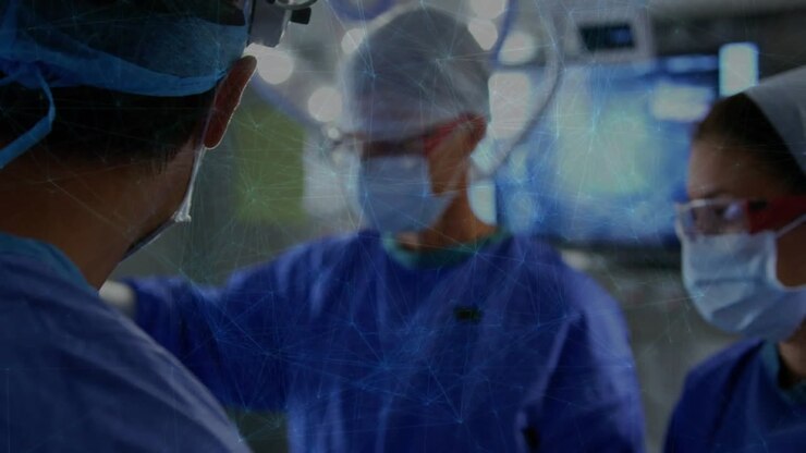 Lead surgeon using loupes, central surgeon raising arm reaching sterile field, nurse prepping tools
