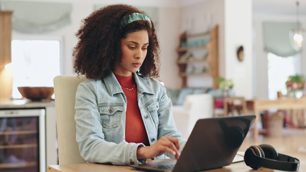 Woman working on a laptop at home