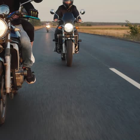 A-group-of-bikers-rides-along-the-highway-in-a-row-3