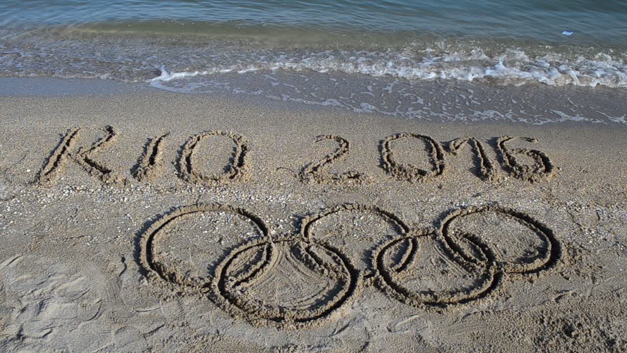 Rio 2016 an inscription on sand, the beach. Symbol Olympic game on sand, the beach
