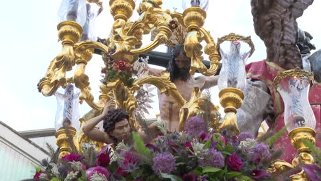 religious procession with floral decorations