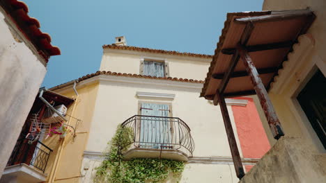 Walking-through-the-narrow-streets-of-Lakones-mountain-village-in-Corfu,-Greece