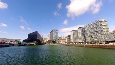 time lapse clouds passing over contemporary modern urban city business waterfront buildings skyline