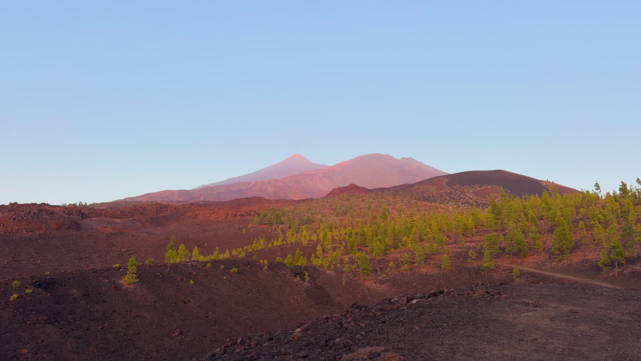 Volcanic landscape in Tenerife with Mount Teide in the background at sunset
