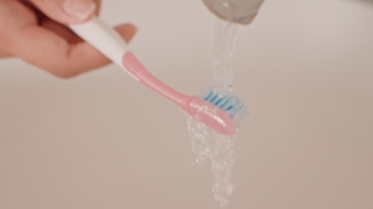 Dawn hygiene ritual. Serene morning ritual of rinsing bristles in warm light. Calm dawn hygiene practice involving gentle brushing and soothing water rinses in peaceful hotel surroundings