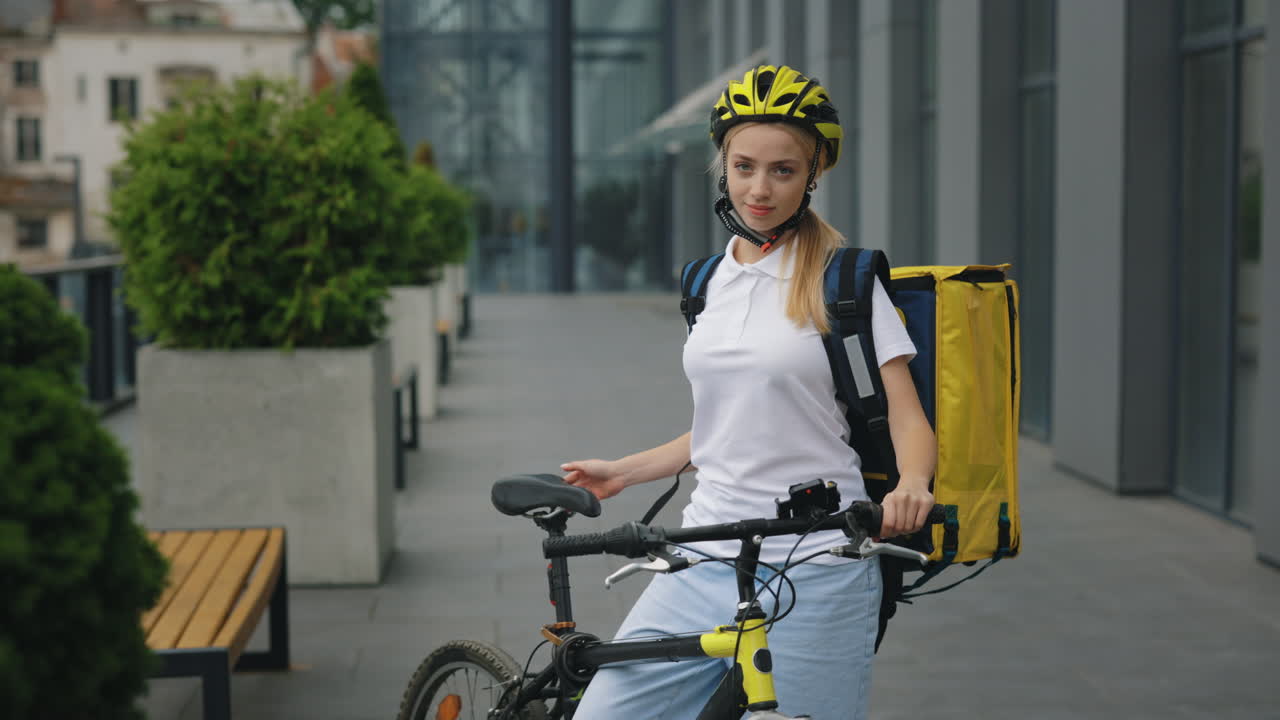 Woman on a bike making a delivery