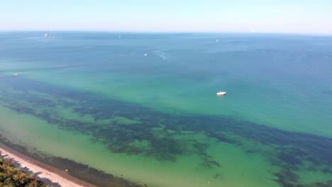 aerial: german north coast in heiligendamm with some ships in the background