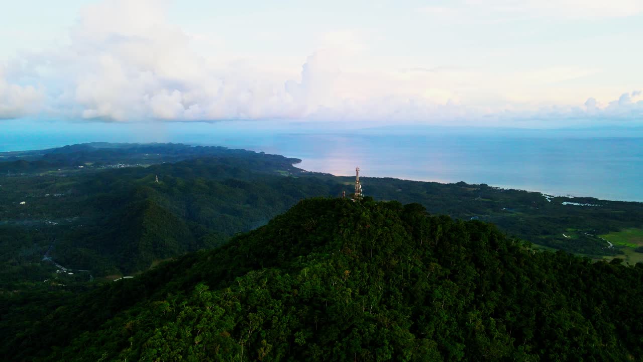 Stunning aerial drone shot of Philippine mountain peak and hiking spot, Mount Cagmasuso, with lush tropical island backdrop - San Andres, Catanduanes, Philippines