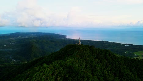 stunning aerial drone shot of philippine mountain peak and hiking spot, mount cagmasuso, with lush tropical island backdrop - san andres, catanduanes, philippines