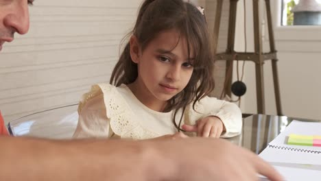 grandfather and granddaughter playing with plasticine
