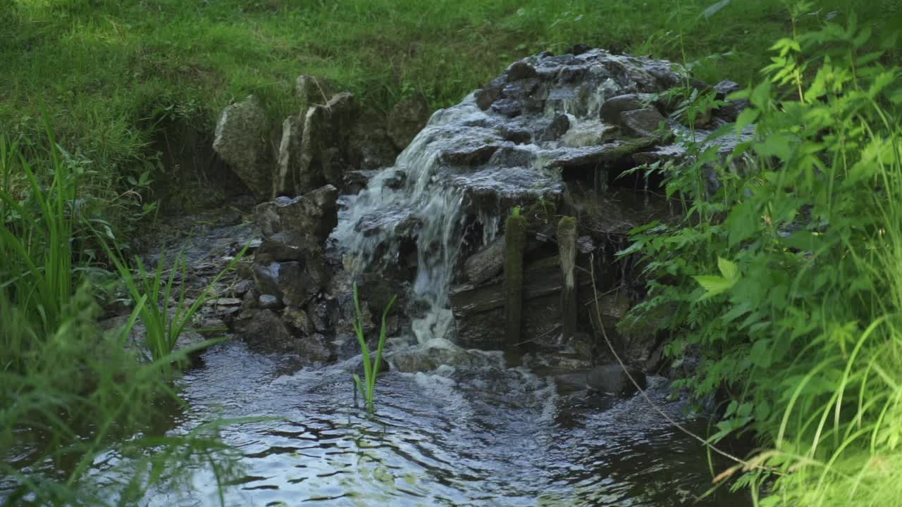 Pond with stone waterfall