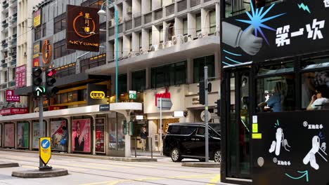 tram and cars moving through city streets