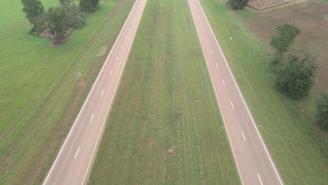 cars passing by on a rural highway in the country