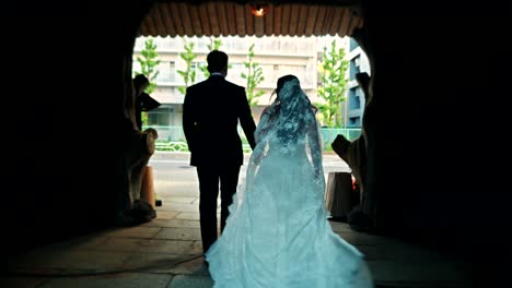 Japanese Wedding Couple Walking Through an Archway