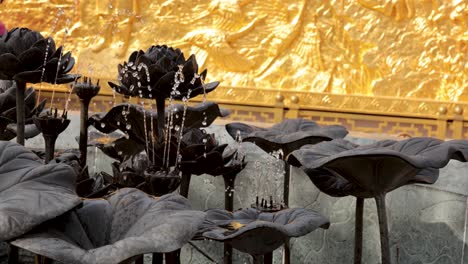 lotus sculpture with dynamic water fountain display