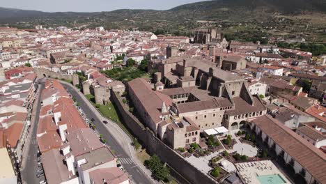 aerial view circling mirabel palace scenic plasencia gothic renaissance tiled cityscape rooftops, spain