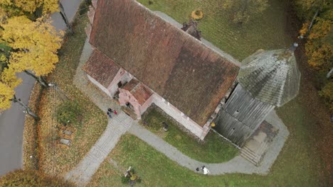 drone view of a beautiful historic church in the middle of a village