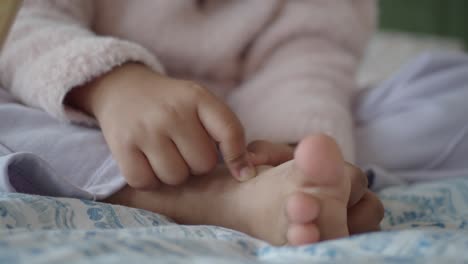 baby exploring their feet