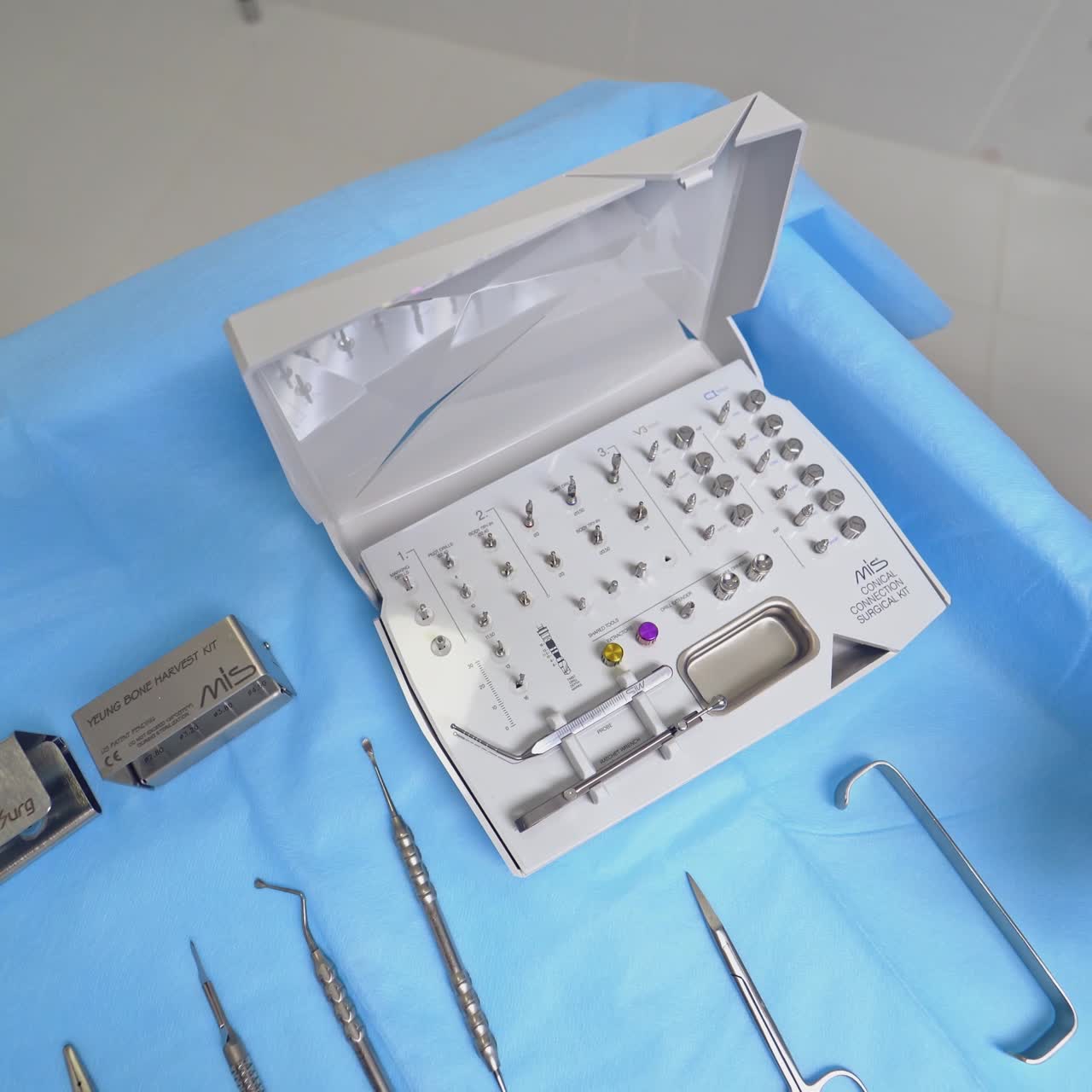Modern dental equipment on the sterile table. Dentist is taking tool for teeth treatment at dental clinic. Doctor is using new medical instruments.