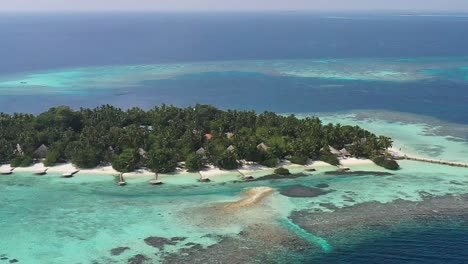 amazing aerial view of maldives islands with turquoise water, palms and white sand