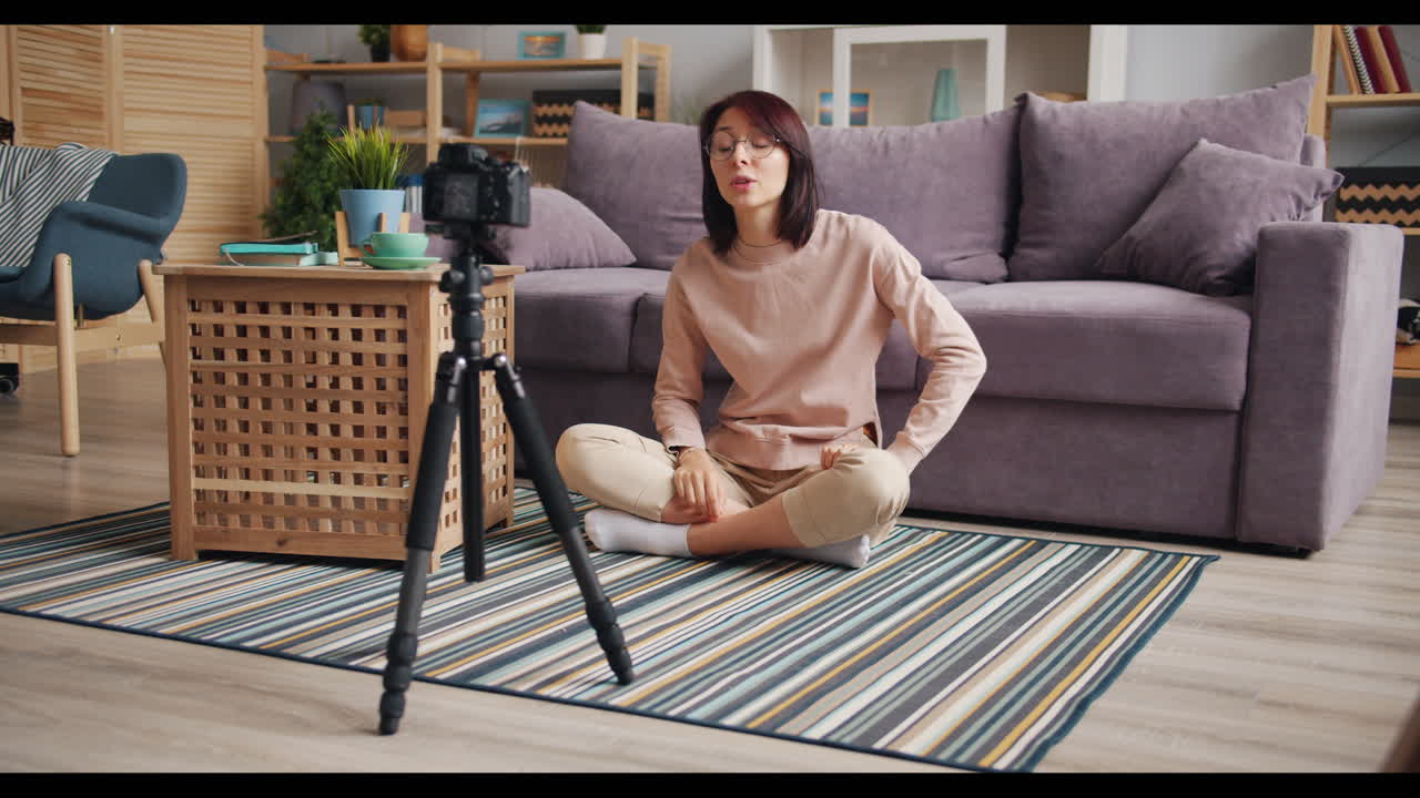Woman vlogging in her living room