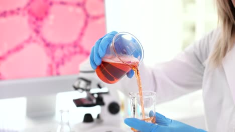 Scientist pouring liquid in a laboratory experiment