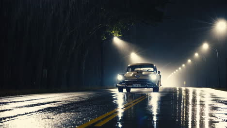 vintage car driving on a rainy night