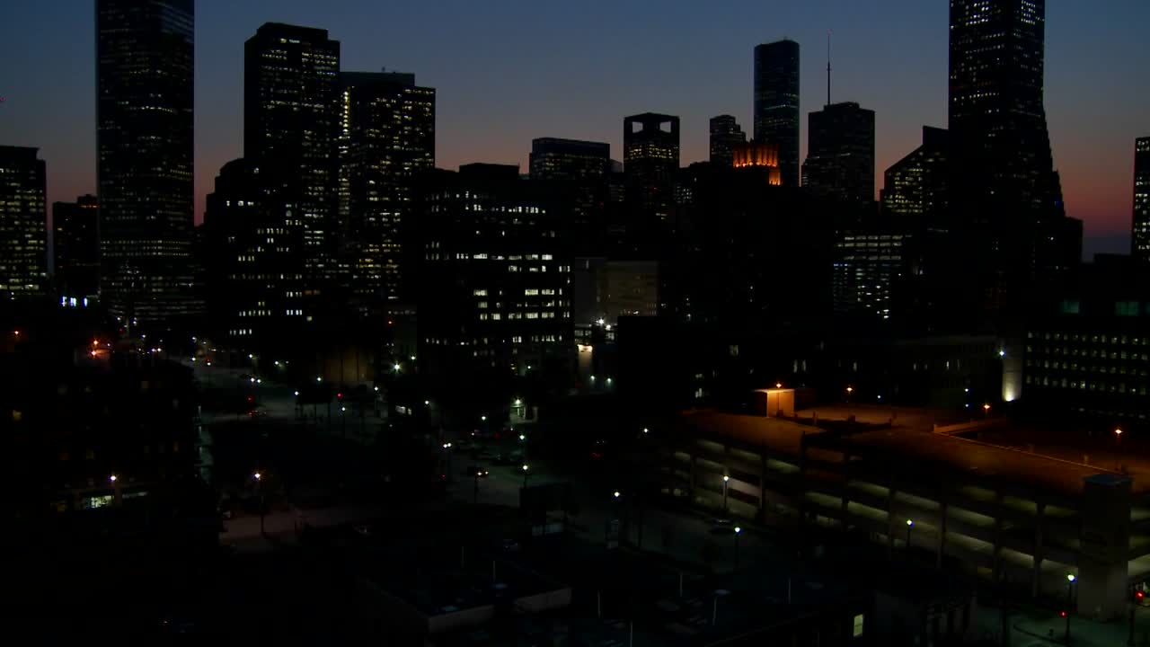 Tilt up to the Houston skyline at dusk
