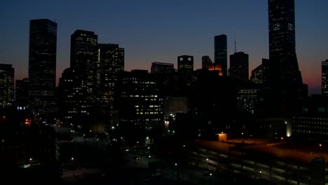 tilt up to the houston skyline at dusk