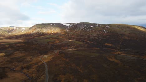 beautiful aerial of distant mountain in the iceland countryside