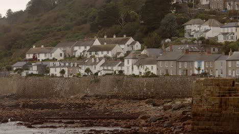 shot of mousehole cornwall low tide looking past the harbour