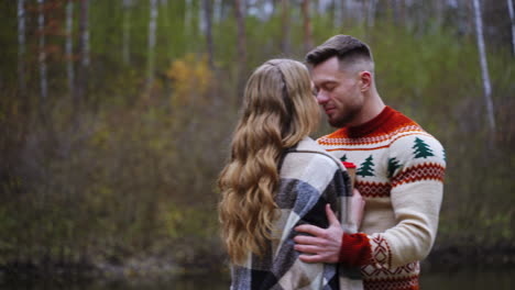 lovely couple posing in autumn forest. lovers walking in park. love story in forest. man and woman. happy couple outdoors.
