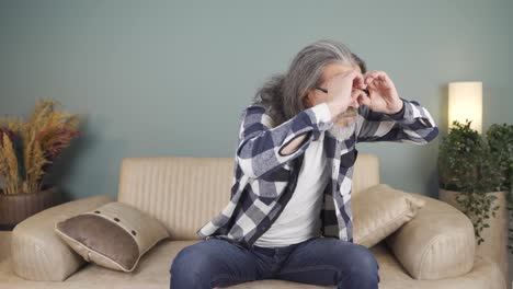 man with binoculars looking away.