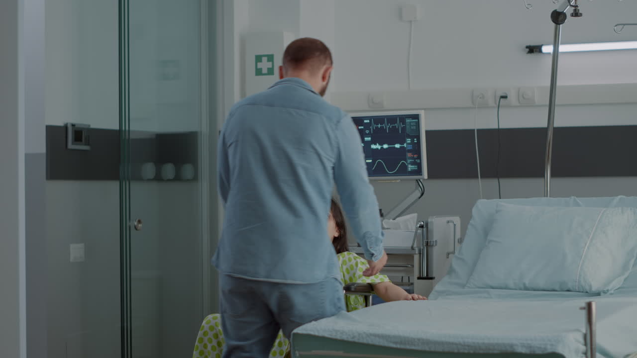Happy man assisting pregnant wife with wheelchair