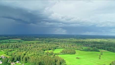 High-aerial-panoramic-view-of-a-varying-green-landscape-with-forests