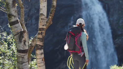 a female hiker standing at the end of the rocky trail