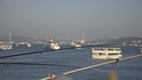 Fishermen-fishing-on-the-Bosphorus,-Galata-Bridge,-with-a-sea-view