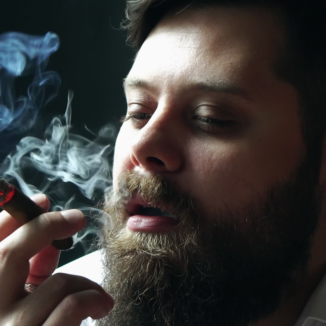 Brutal man smoking cigar