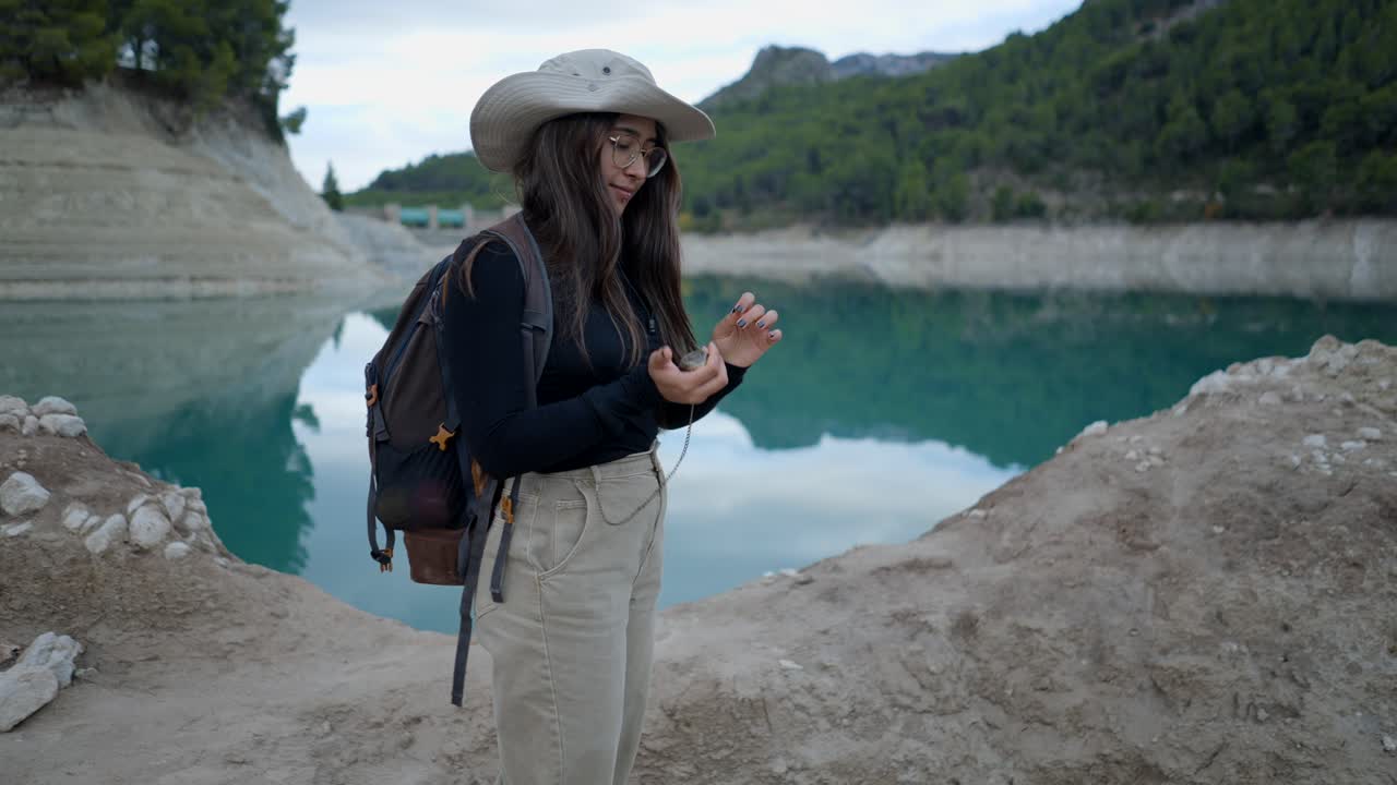 Woman Hiking by a Mountain Lake
