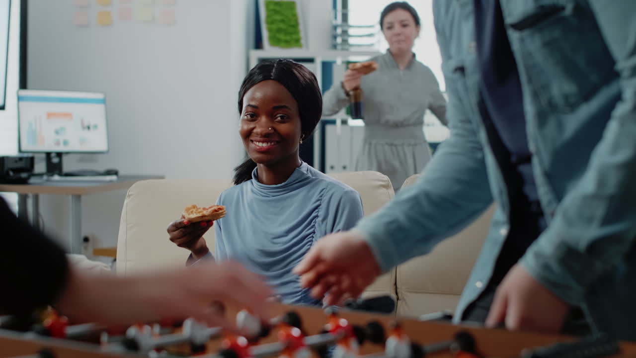 Portrait of african american woman drinking beer from cup
