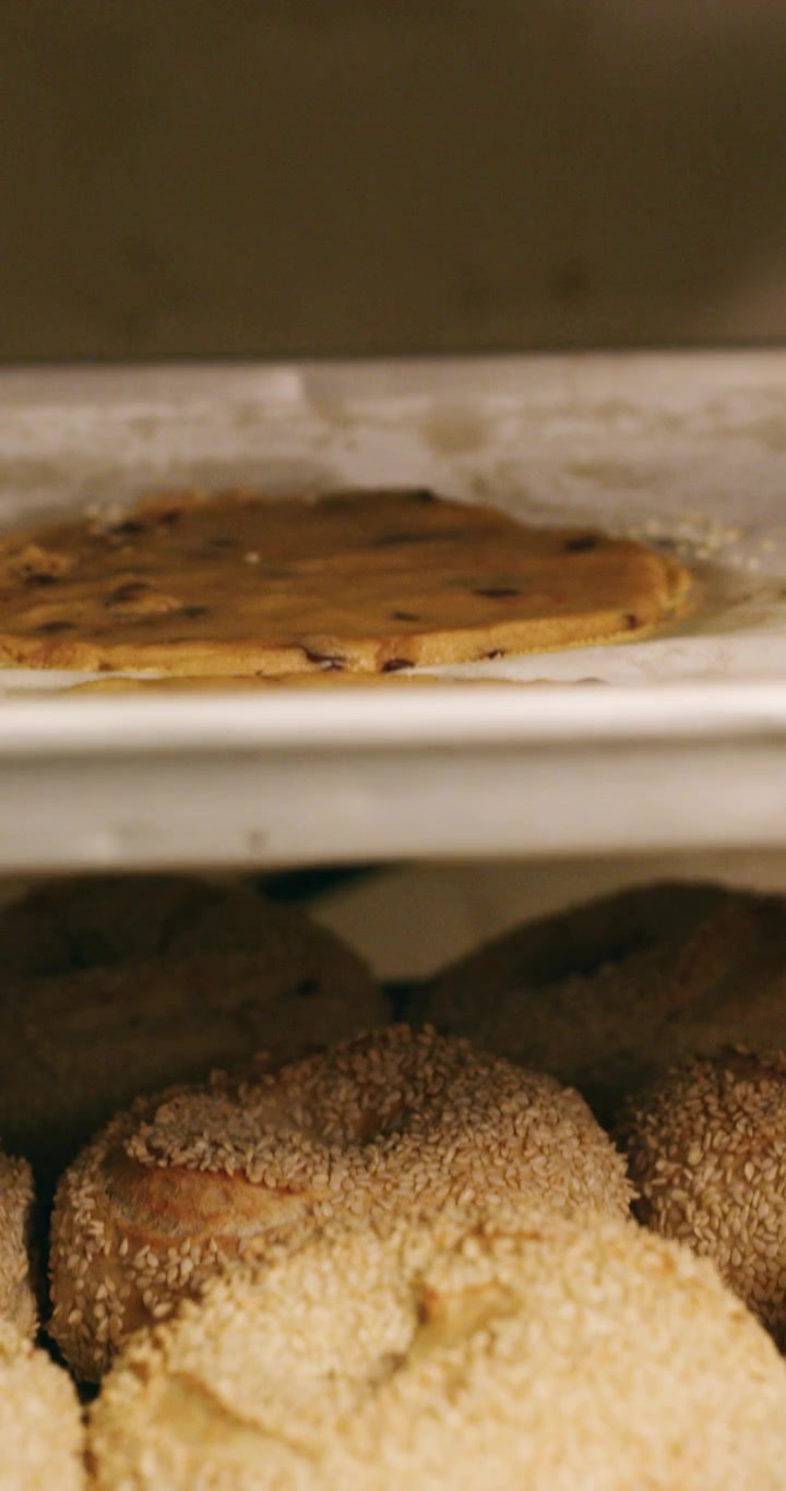Freshly Baked Bagels and Cookies on Metal Bakery Racks