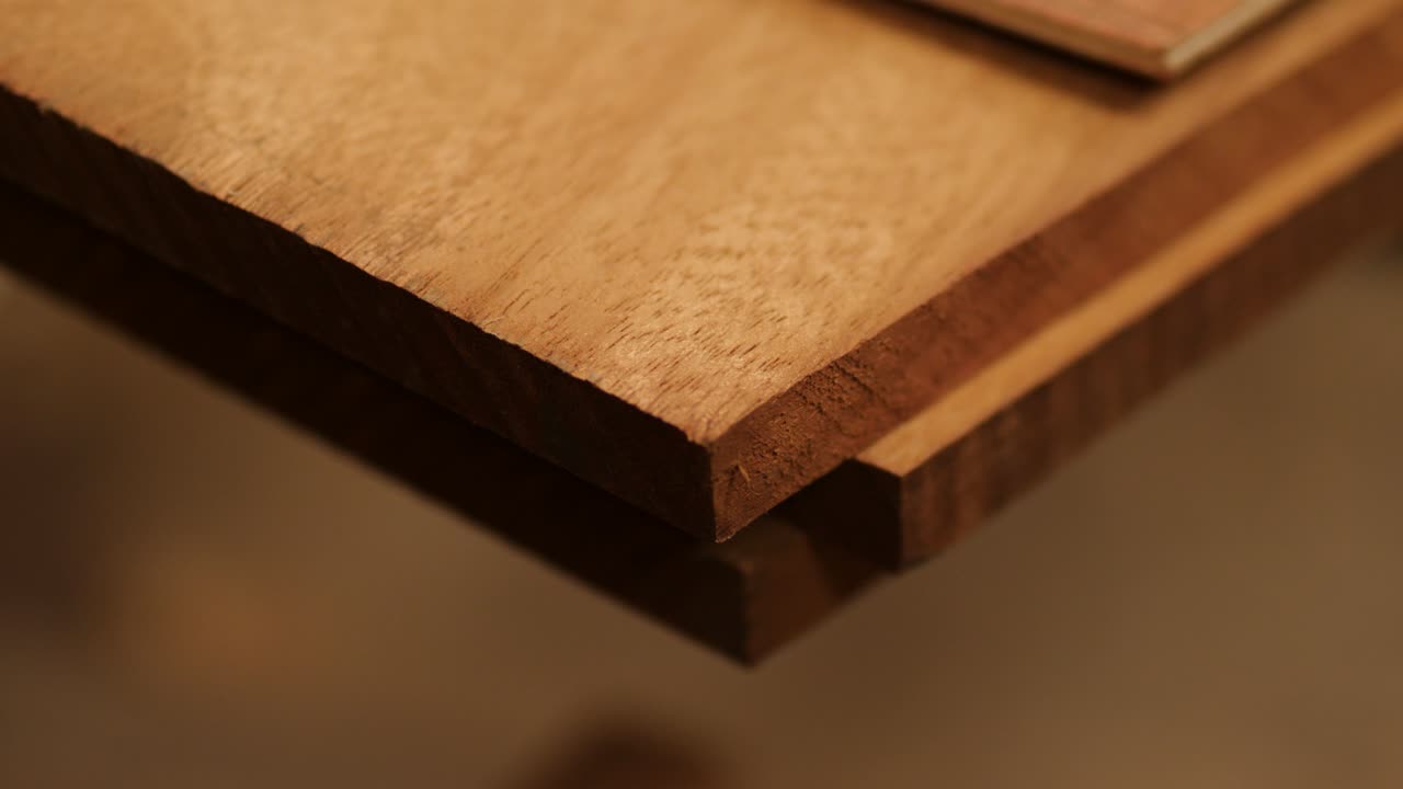 Planed Iroko wood planks stacked