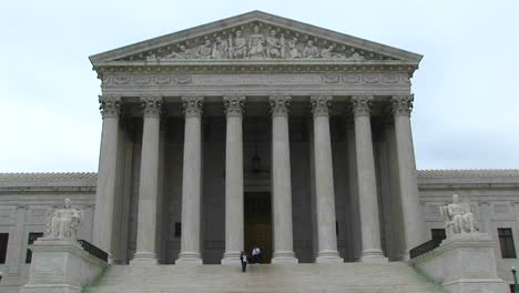 a panup of the columned entrance to the supreme court