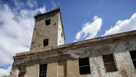 old factory and industrial complex with passing clouds