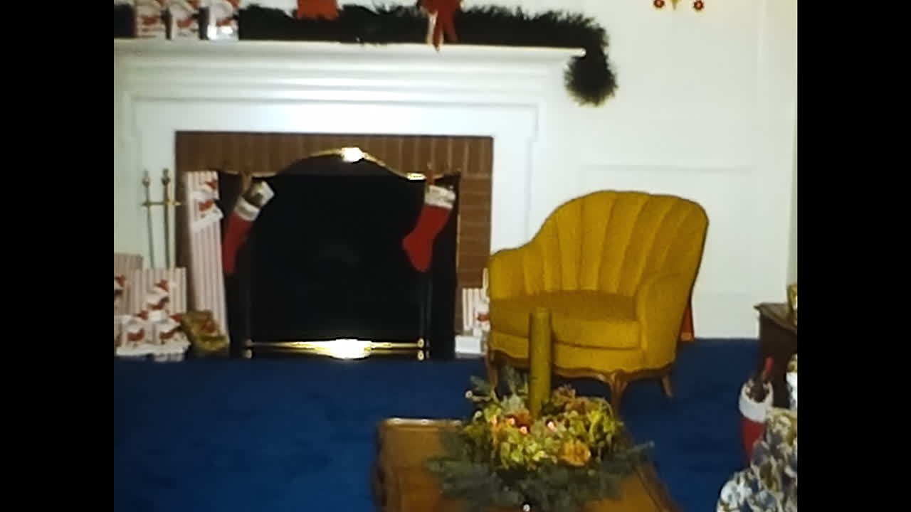 Christmas Tree in Living Room Next to Window. CIRCA USA - 1970s: A photo capturing a 1970s Christmas tree beautifully adorned with ornaments, placed in a living room with a view of the outside through a window.
